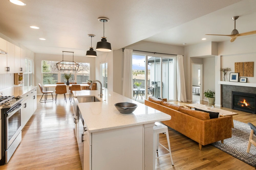 Open concept kitchen with large island leading into living room.