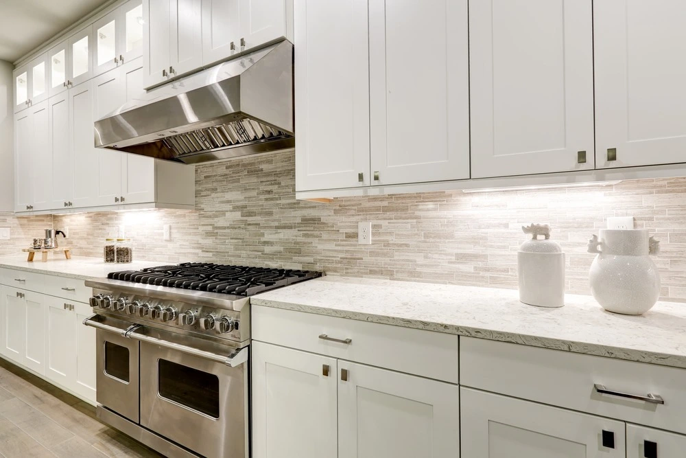 Bright white kitchen with white painted cabinets.