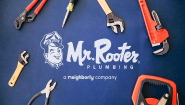  Mr. Rooter logo on a blue background with tools.