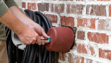 installing faucet covers to avoid frozen plumbing pipes.