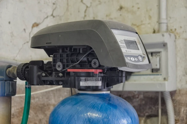 The timer and valve assembly of a water softener