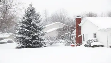 Homes in a suburban neighborhood blanketed in snow. | Mr. Rooter Plumbing of South Jersey