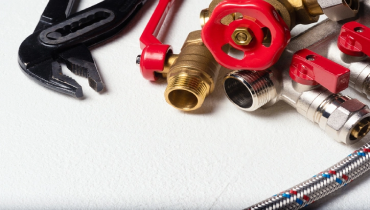 Plumbing tools on a white background.