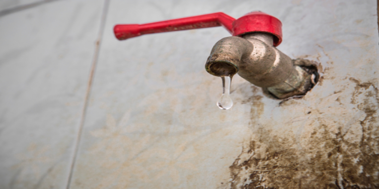 Water leaking out of a water spigot