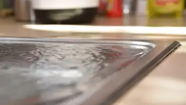 An overflowing sink caused by a clogged drain