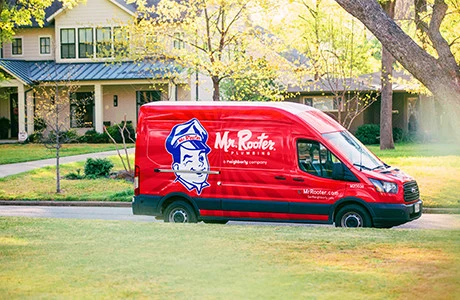 Mr. Rooter van parked outside of a job providing plumbing in Victorville, CA.