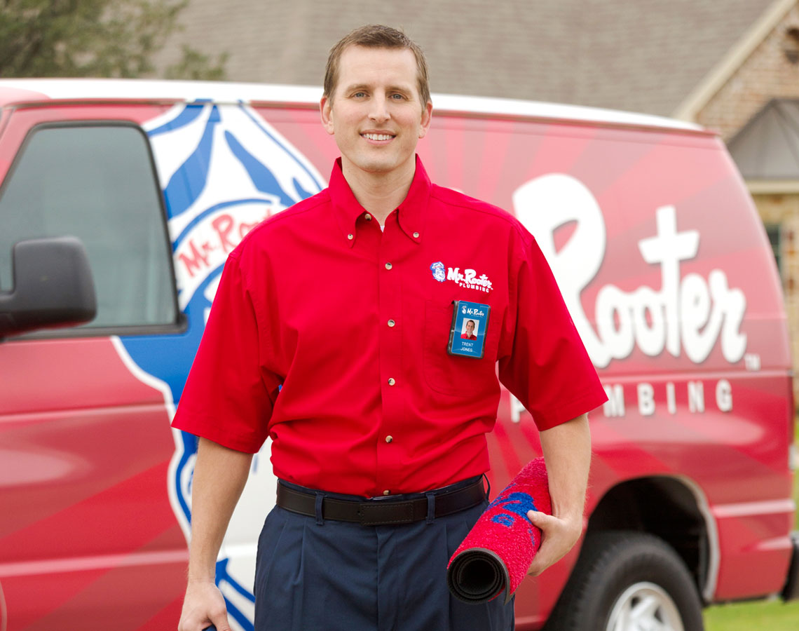 Smiling Mr. Rooter technician 