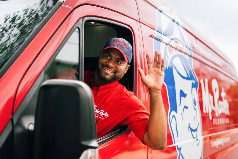 Mr. Rooter plumber arriving at a Dover, DE home