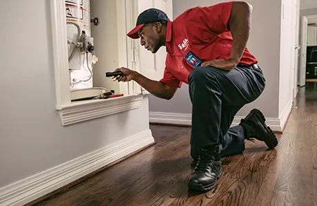 Mr. Rooter Plumber replacing a water heater.