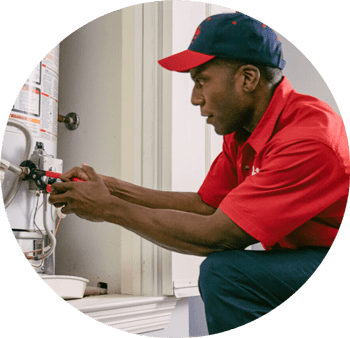 Mr. Rooter technician fixing hot water heater.