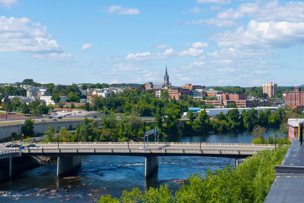 Skyline view of Manchester, NH, showing the city's landmarks and buildings.