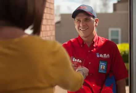  Mr. Rooter residential plumber arriving at a client's home