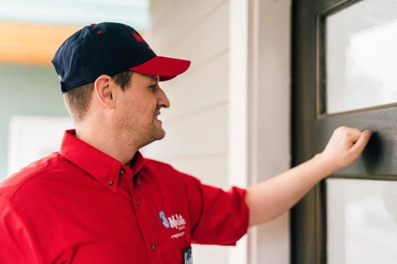 Mr. Rooter service professional arriving for emergency plumbing service