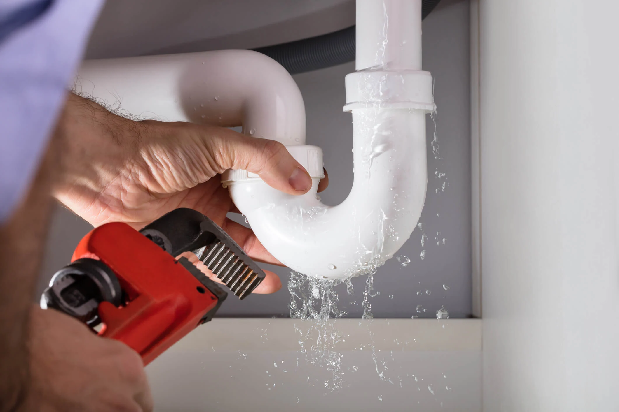 Plumber in in Hurricane, UT fixing a leaky pipe 