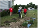 plumbers digging a ditch