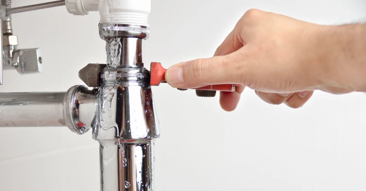 a Mr. Rooter plumber repairing a drain