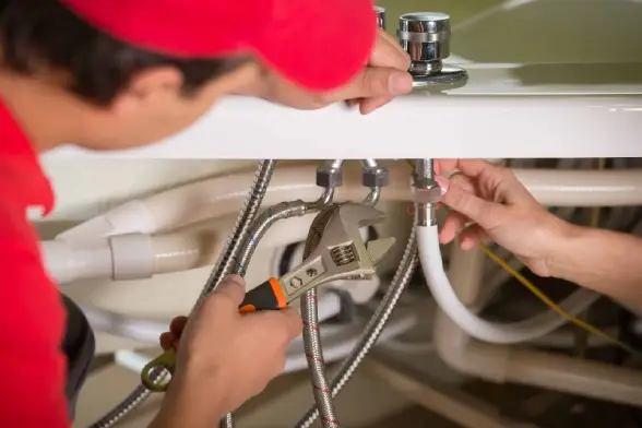 Mr. Rooter plumber helping a customer with a plumbing repair