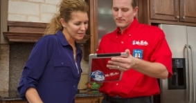 Mr Rooter employee greeting a customer